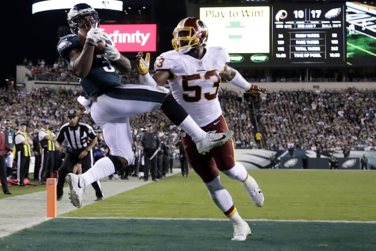 Eagles running back Corey Clement (left) makes a touchdown catch on a pass as Washington Redskins inside linebacker Zach Brown defends during the Eagles’ win on Oct. 23.