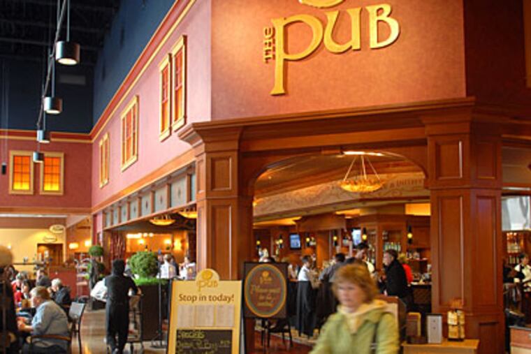 The Pub at Wegmans in Collegeville is a full-service restaurant with a liquor license — unusual, to say the least, for a supermarket in Pennsylvania. (TOM GRALISH / Staff Photographer)