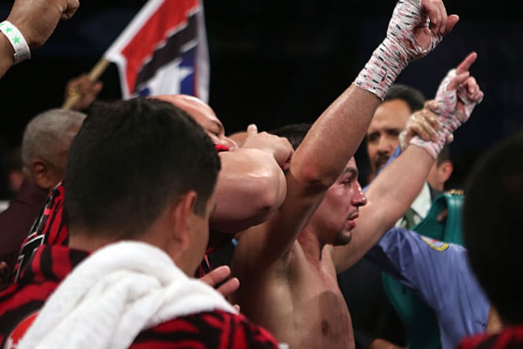 Unified Super Lightweight World Champion Danny "Swift" Garcia celebrates. (Ricardo Arduengo/AP)