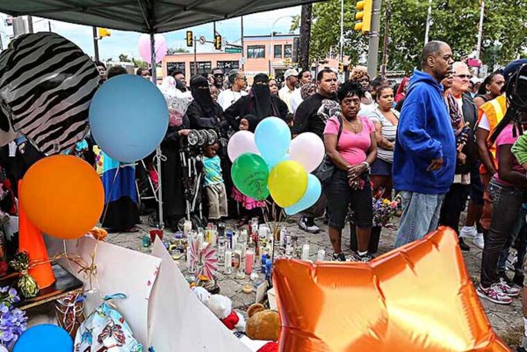 A vigil was held Tuesday at Germantown and Allegheny Avenues, scene of the crash July 25 that took the lives of three children. (Steven M. Falk / Staff Photographer)