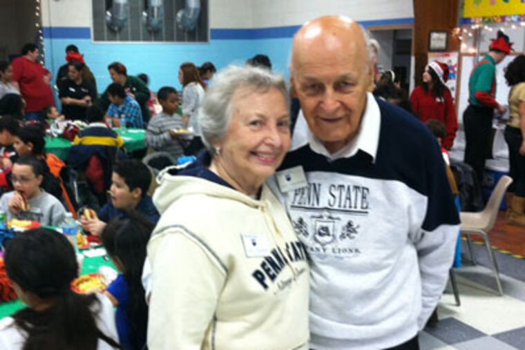 Children from the homework club at the Salvation Army citadel in Camden enjoy a Christmas party 12/10 at St. Joan of Arc in Marlton, courtesy of the SJ. chapter of the Penn State alumni association. 50 kids attended. Joan and John Ungvarsky of Cinnaminson helped organize the annual Christmas party. (Kevin Riordan / Inquirer Staff )