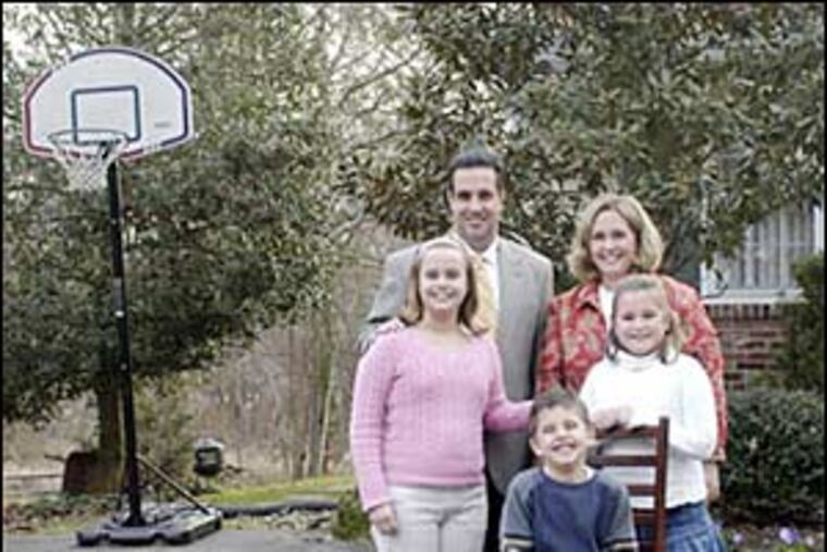 Laura and Brian Cooper, with their children Emily (left), Christopher and Gabrielle.