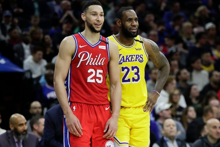 Sixers guard Ben Simmons and Los Angeles Lakers forward LeBron James in a January, 2020 photo.