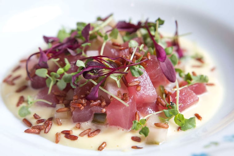 Diced raw ahi tuna with puffed red rice, hijiki salad, and cool pickled cukes at Bistro 7.