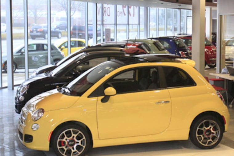 In a Feb. 29, 2012 photo, Fiat 500 vehicles are displayed at the Golling Fiat dealership in Birmingham, Mich. Chrysler Group was the first automaker to report sales Tuesday, April 3, 2012. Its U.S. sales jumped 34 percent in March on strong sales of Fiat small cars and Chrysler sedans. (AP Photo/Carlos Osorio)