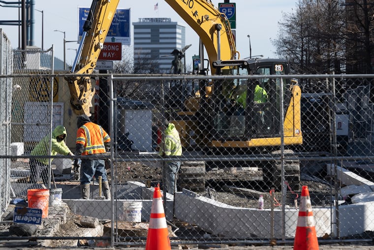 Workers at a construction site along Market Street in Philadelphia on Jan. 22, 2026.