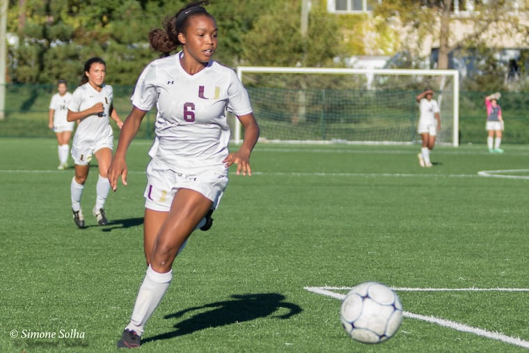 Kayla Miller-People playing high school soccer.