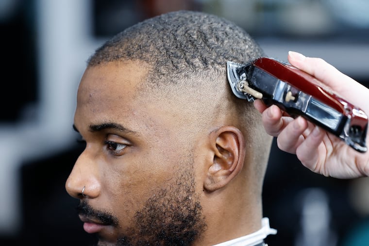 Cameron Green of Brewerytown gets his version of the "Travis Kelce cut," a.k.a. the tried-and-trusted fade at LB Cuts in Fishtown by stylist Kimberly Moyer on Friday, February 2, 2024.