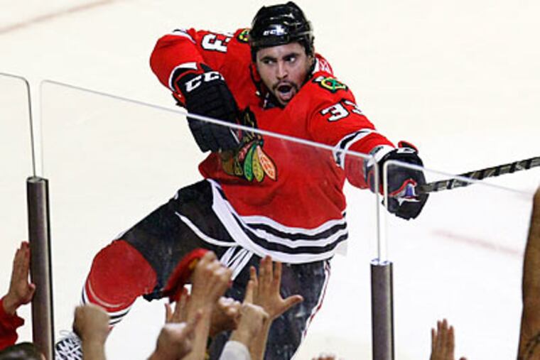 The Blackhawks are aiming for their first Stanley Cup since 1961. (Charles Rex Arbogast/AP)