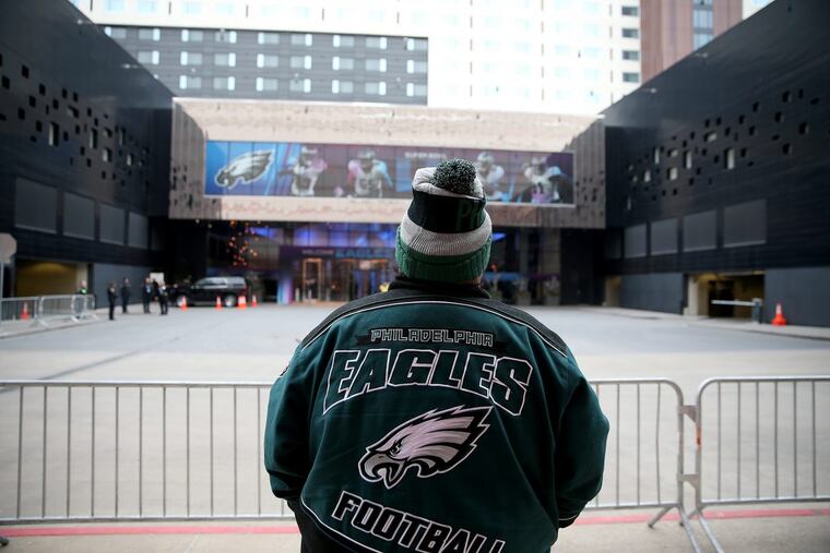 Philadelphia Eagles fan Frank Rodriguez, of St. Paul, MN, waits for the team to arrive outside its hotel in Bloomington, MN on January 28 2018.