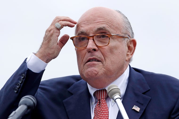 In this Aug. 1, 2018 file photo, Rudy Giuliani, an attorney for President Donald Trump, addresses a gathering during a campaign event for Eddie Edwards, who is running for the U.S. Congress, in Portsmouth, N.H.