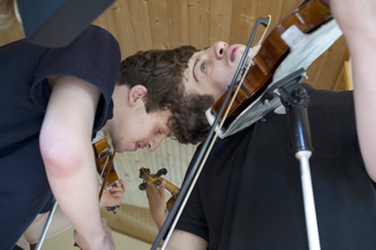 19-year-old conjoined twins Tyler (left) and Stefan Delp do well academically and are musically gifted. (Sharon Gekoski-Kimmel / Staff Photographer)