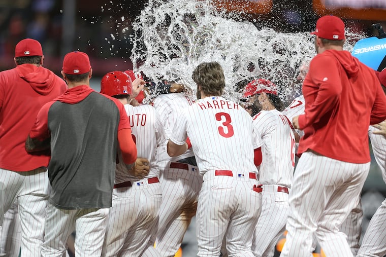 Phillies' Jay Bruce center celebrates with teammates his walk off double to beat the Mets 5-4 in 10 innings at Citizens Bank Park in Philadelphia, Wednesday, June 26, 2019