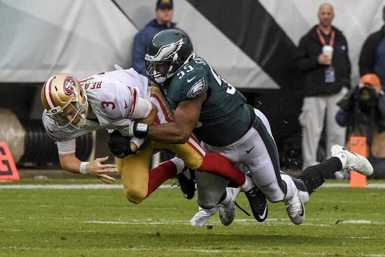 Eagles defensive end Brandon Graham tackles San Francisco 49ers quarterback C.J. Beathard after a scramble.
