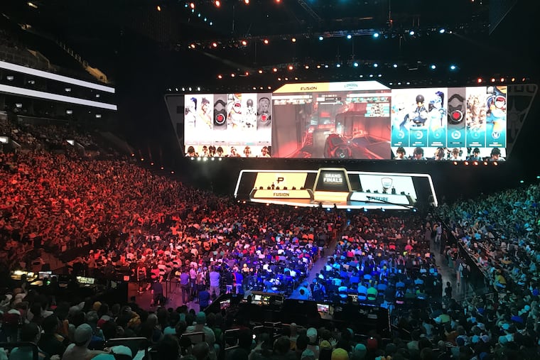 Fans of the e-sports Overwatch League watch as the sixth-seeded Philadelphia Fusion compete against the fifth-seeded London Spitfire in the Overwatch League Grand Finals at the Barclays Center in New York City on Saturday, July 28. Philadelphia lost to London 2-0 to finish second in the league and take home $400,000 in prize money.