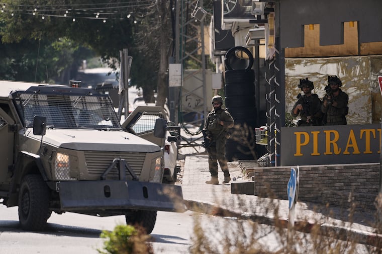Israeli soldiers stand in guard on a street outside the Nablus Speciality Hospital in the West Bank city of Nablus, Friday, July 24, 2026, after Israeli military killed, according to health authorities, at least four Palestinians in the village of Tell in the northern West Bank.