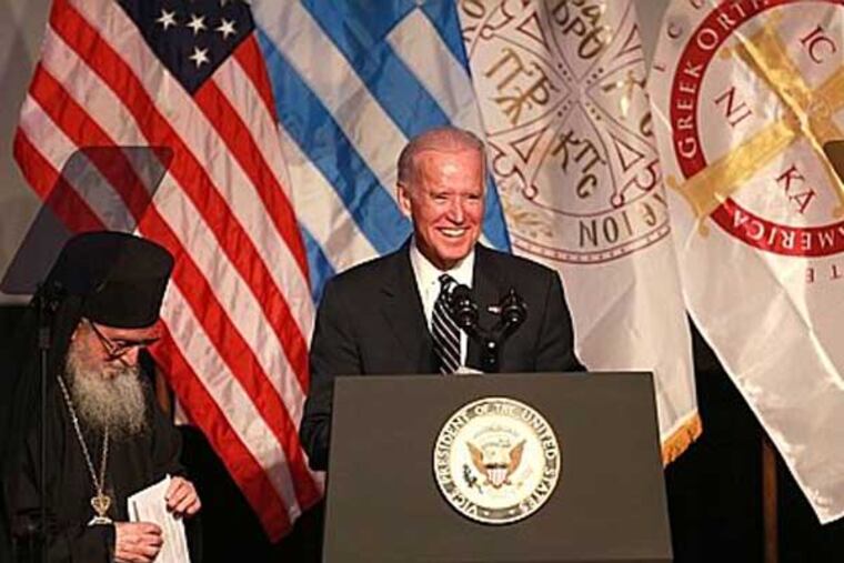 Vice President Joe Biden is introduced by his Eminrence Archbishop Demetrios of America *( R ) at the Grand Banquet of the 42nd Biennial Clergy-Laity Congress of the Greek Orthodox Archdiocese of America in Philadelphia Wednesday July 9, 2014. ( DAVID SWANSON / Staff Photographer )