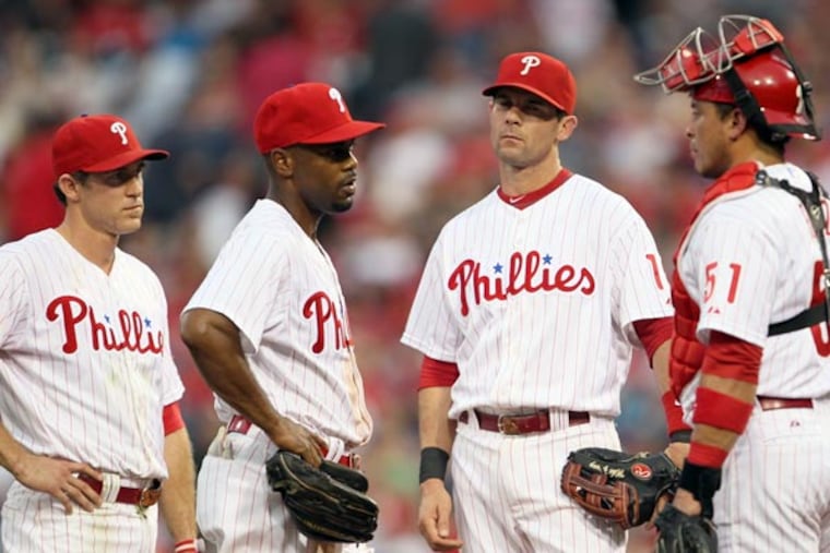 Michael Young, Chase Utley and Jimmy Rollins. (Yong Kim/Staff Photographer)