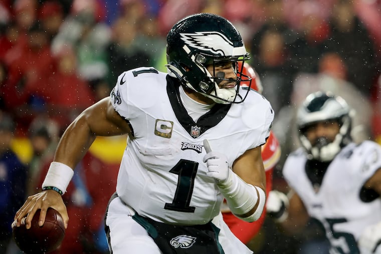 Eagles quarterback Jalen Hurts scrambles as he looks for an open receiver against the Chiefs at Arrowhead Stadium on Nov. 20.