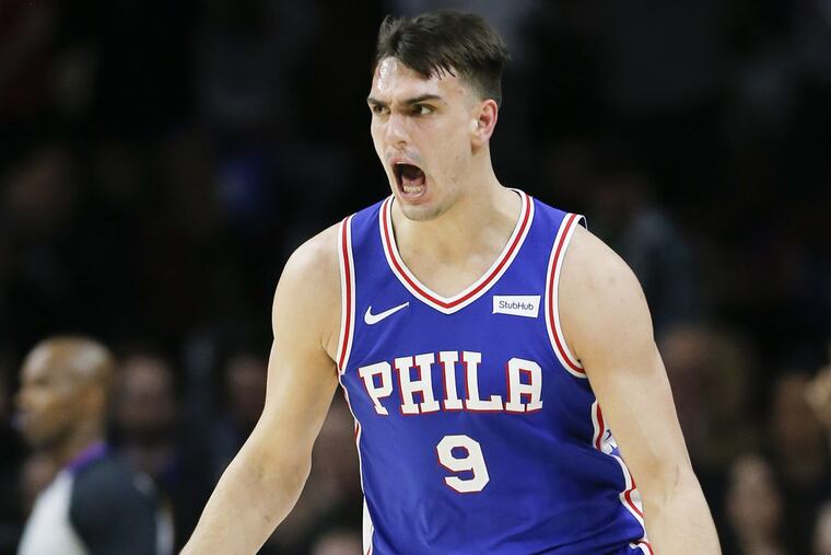 Sixers forward Dario Saric celebrates a three-point basket against the New York Knicks on Monday, February 12, 2018 in Philadelphia.