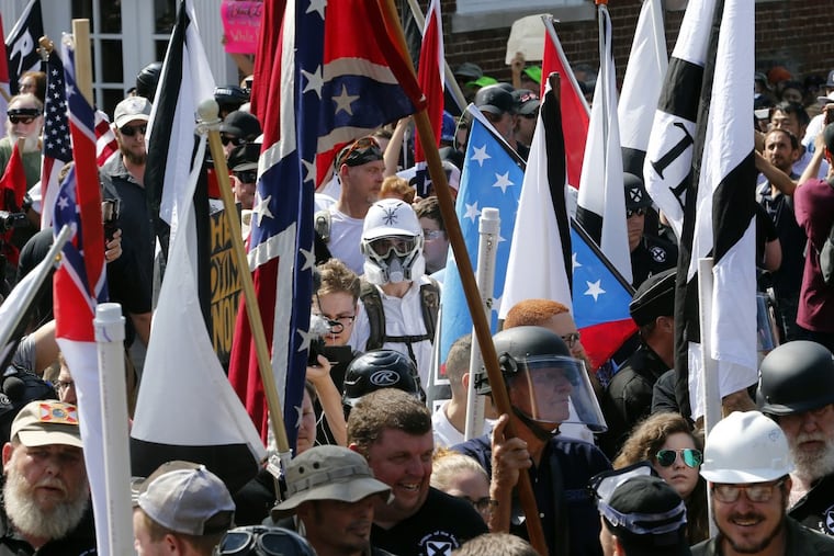 White nationalist demonstrators march in Charlottesville, Va., in 2017. The racist rally erupted in violence, killing Heather Heyer. There were "some very fine people on both sides," President Donald Trump said in response.