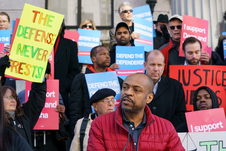 Reggie Shuford, executive director of the ACLU of Pennsylvania, speaks to protestors gathered on the steps of the Montgomery County Courthouse about the firings of public defenders Dean Beer and Keisha Hudson in Norristown, Pa., March 5, 2020.