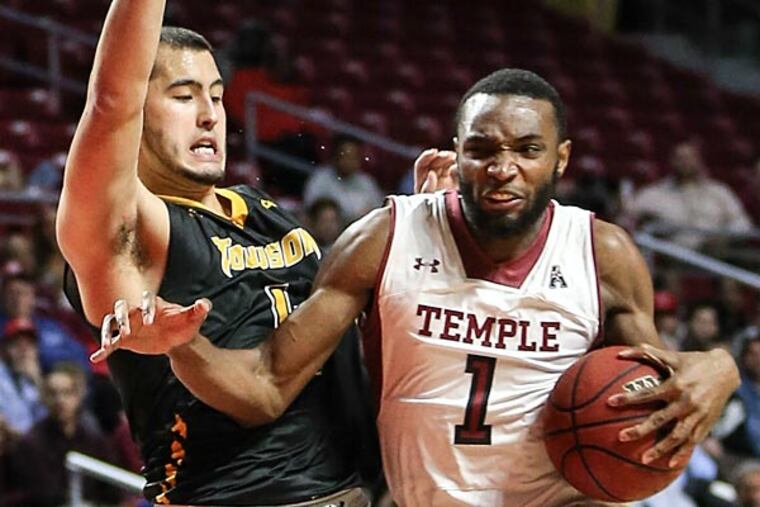 Temple's Josh Brown drives on Towson's Four McGlynn. (Steven M. Falk/Staff Photographer)