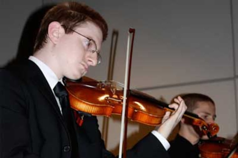 Tyler Clementi in 2009 playing with Ridgewood High School Orchestra. The Rutgers student jumped to his death after authorities say classmates recorded him having sex. (AP Photo/The Record of Bergen County, Ryan Pifher)