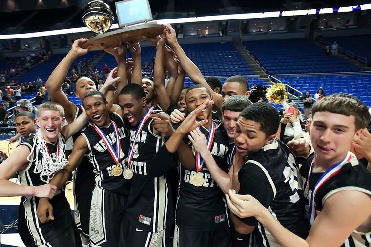 Neumann-Goretti celebrates beating Montour for the PIAA Class 3A state basketball championship in State College on March 23, 2012.
