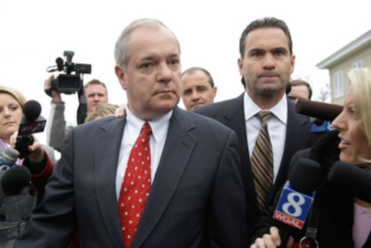 Former Pennsylvania House Speaker John Perzel R-Philadelphia, walks through members of the media after attending a hearing in Harrisburg. (AP File Photo)