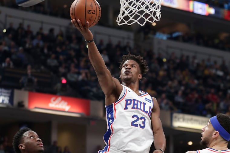 Jimmy Butler shoots in front of Pacers guard Victor Oladipo (left) during the first half.