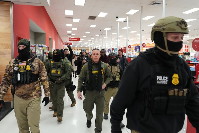 Border Patrol Cmdr. Gregory Bovino walks through a Target store on Jan. 11 in St. Paul, Minn.