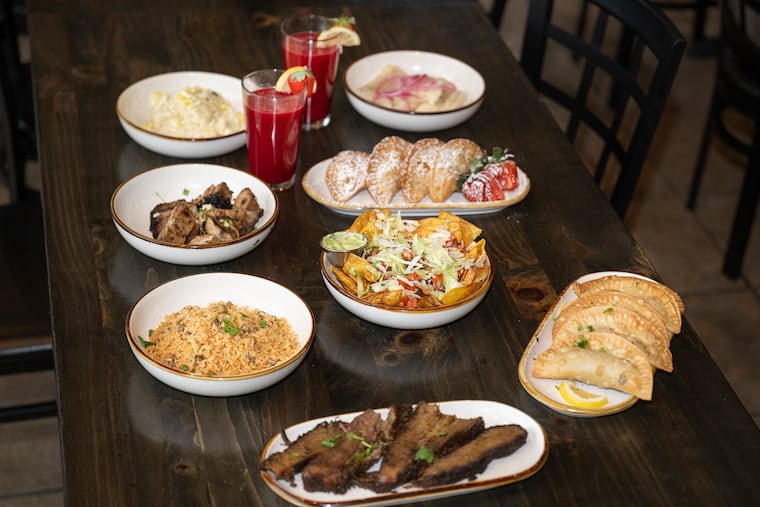 A table of Puerto Rican appetizers, mains, and side dishes from Carmen's Table, a new Puerto Rican -inspired barbecue restaurant in Glendora, N.J.
