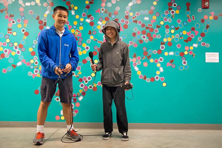 Sunny Li (left), 13, and Andy Ni, 12, take part in a Social Practice Lab recording workshop at the Asian Arts Initiative, one of the Philly arts groups that would lose federal funding if the NEA and other agencies get axed under President Trump’s proposed budget.