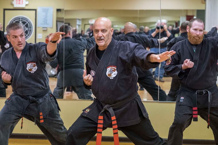 Dennis Nackord leads a master class in a group exercise at his Wayne studio.