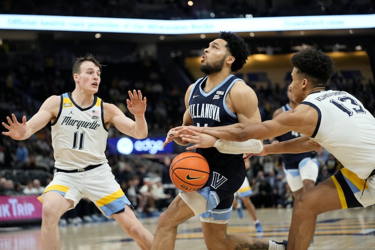 Caleb Daniels (center) finished with 14 points, but Villanova dropped to 0-6 against Quad 1 opponents with the loss to Marquette.