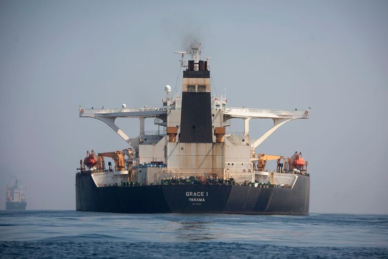 A stern view of the Grace 1 super tanker in the British territory of Gibraltar, Thursday, Aug. 15, 2019, seized last month in a British Royal Navy operation off Gibraltar. The United States moved on Thursday to halt the release of the Iranian supertanker Grace 1, detained in Gibraltar for breaching EU sanctions on oil shipments to Syria, thwarting efforts by authorities in London and the British overseas territory to defuse tensions with Tehran. (AP Photo/Marcos Moreno)