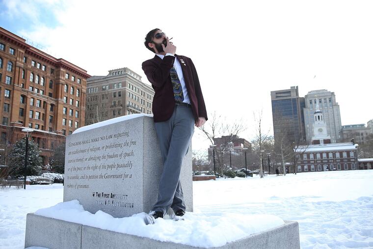Marijuana activist N.A. Poe smokes a joint in February. He's impressed police went along with the law.
