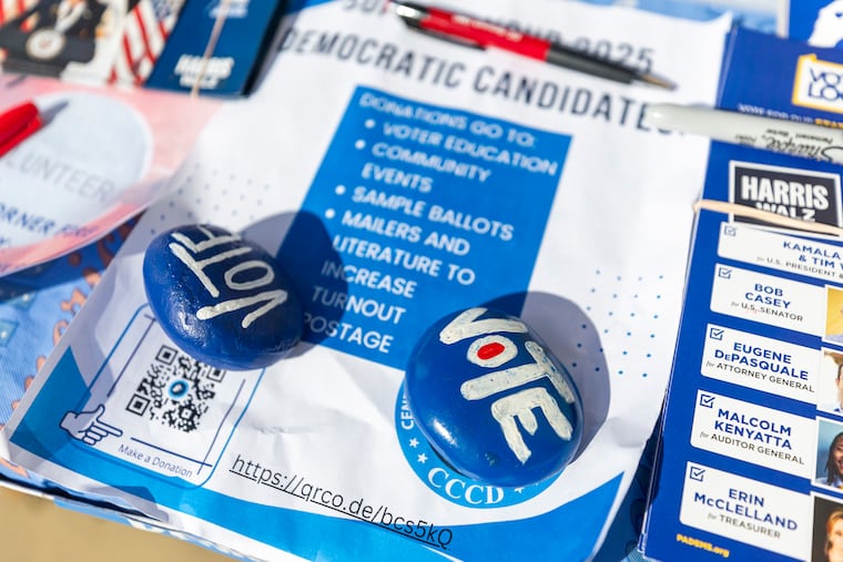 Rocks painted with the word “Vote” sit on a table outside the polling entrance of the East Brandywine Township Municipal Building in East Brandywine Township, Pa., on Tuesday, Nov. 5, 2024.