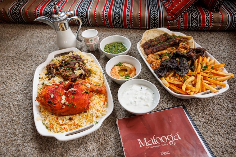 The haneeth and mandi duo, (lamb, chicken, and rice) beside the mixed grill, (lamb, chicken, and beef with fries) available at Malooga, 134 Chestnut St. Malooga is opening a second location, at 203 Haverford Ave., in Narberth this fall.