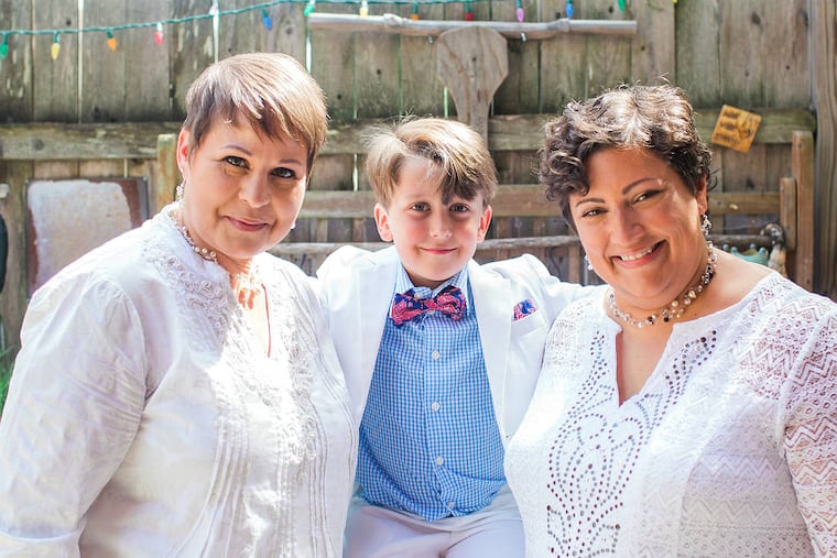 Brides Denine Braden (left) and Liz Gorniak, with their son, Nate. (TRICIA BURROUGH / Lilac Blossom Photography)