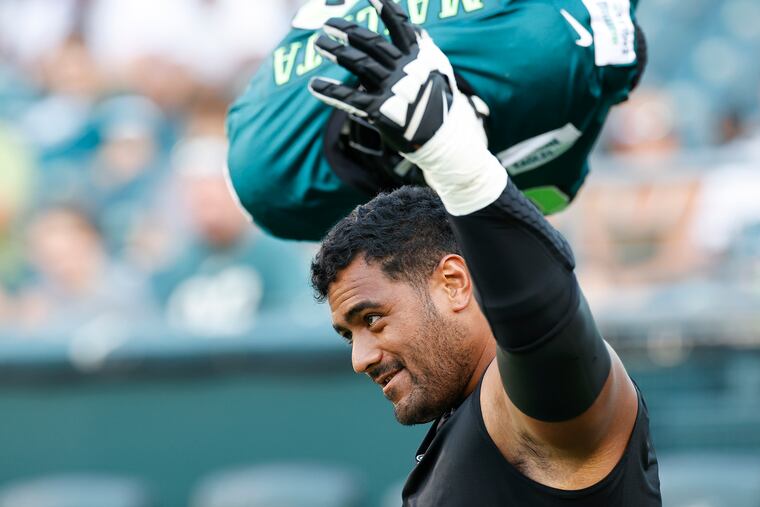 Eagles offensive tackle Jordan Mailata waves to fans during training camp at Lincoln Financial Field on Sunday, August 8, 2021.