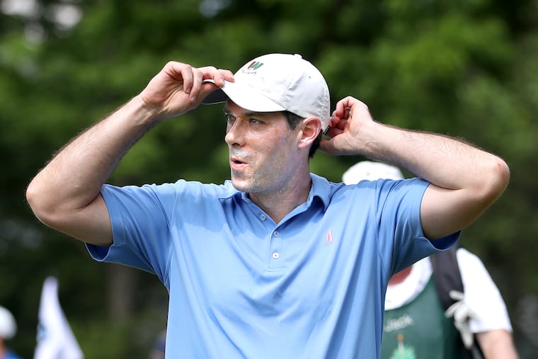 Michael McDermott straightens his hat as he walks of the course after defeating Jack Melville in match play during the Philadelphia Amateur Golf Tournament at the Philadelphia Cricket Club in 2017.