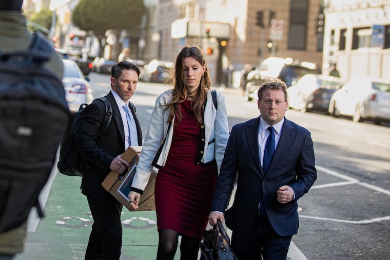 Members of Elon Musk's legal team, including attorney Michael Lifrak (left) exit the Phillip Burton Federal Building in San Francisco, Wednesday, March 4, 2026.