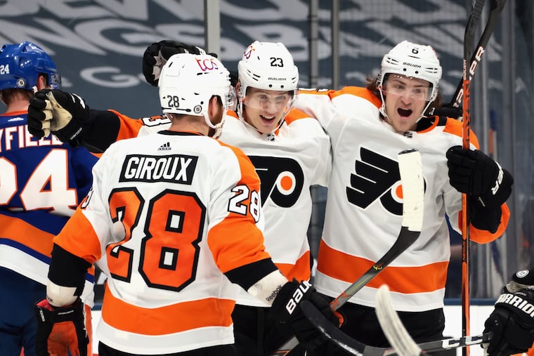 The Flyers' Oskar Lindblom (23) celebrates his late goal with his teammates Thursday, lifting Philly to a 4-3 win over the host New York Islanders.