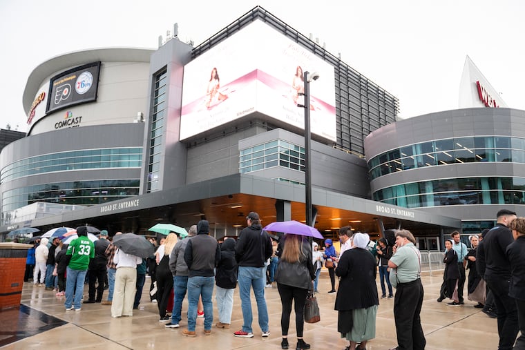 People wait in line to attend Saturday's Life Surge event at the Wells Fargo Center in South Philly.