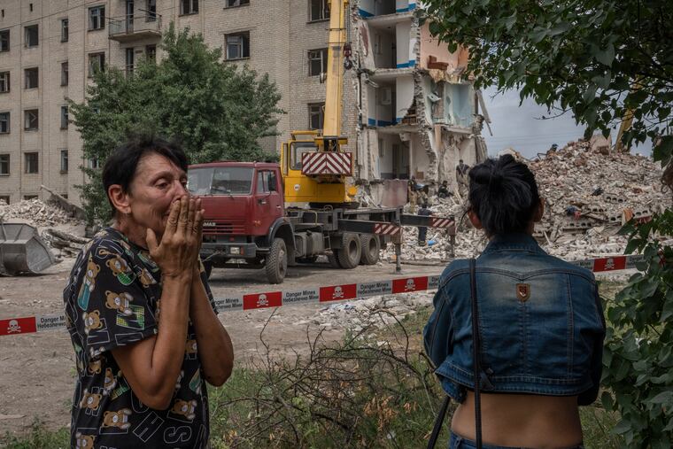 Iryna Shulimova, 59, weeping at the scene in the aftermath of a Russian rocket that hit an apartment residential block, in Chasiv Yar, Donetsk region, eastern Ukraine, on Sunday.