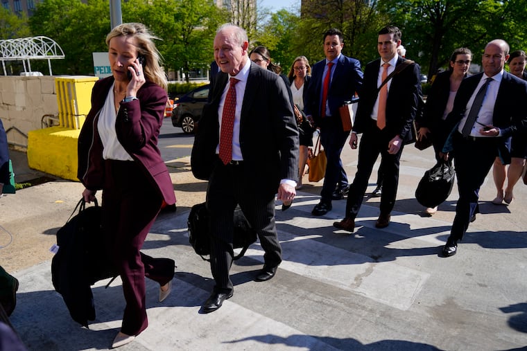 Fox News attorney Daniel Webb walks from the New Castle County Courthouse in Wilmington, Del.