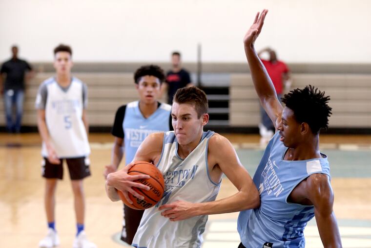 John Camden (center) helped the Patriots beat the Ghosts on Friday.
