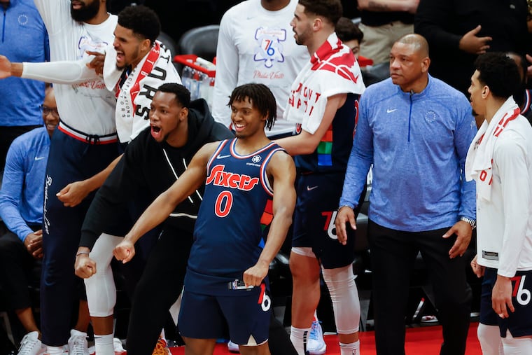The Sixers celebrate late in game six of the first-round Eastern Conference playoffs against the Toronto Raptors on Thursday in Toronto. The Sixers beat the Raptors 132-97 and move on the meet the Miami Heat in the second round of the Eastern Conference playoffs.